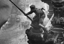 Ukrainian Alexei Berest hoists Victory Banner over Reichstag on May 01, 1945