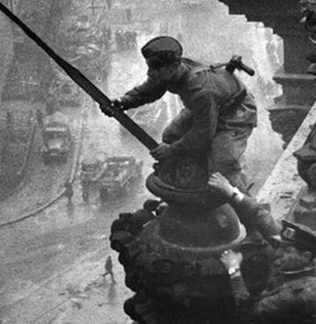 Ukrainian Alexei Berest hoists Victory Banner over Reichstag on May 01, 1945